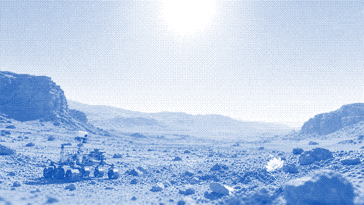 A rover studying a small flower on a quiet red landscape.